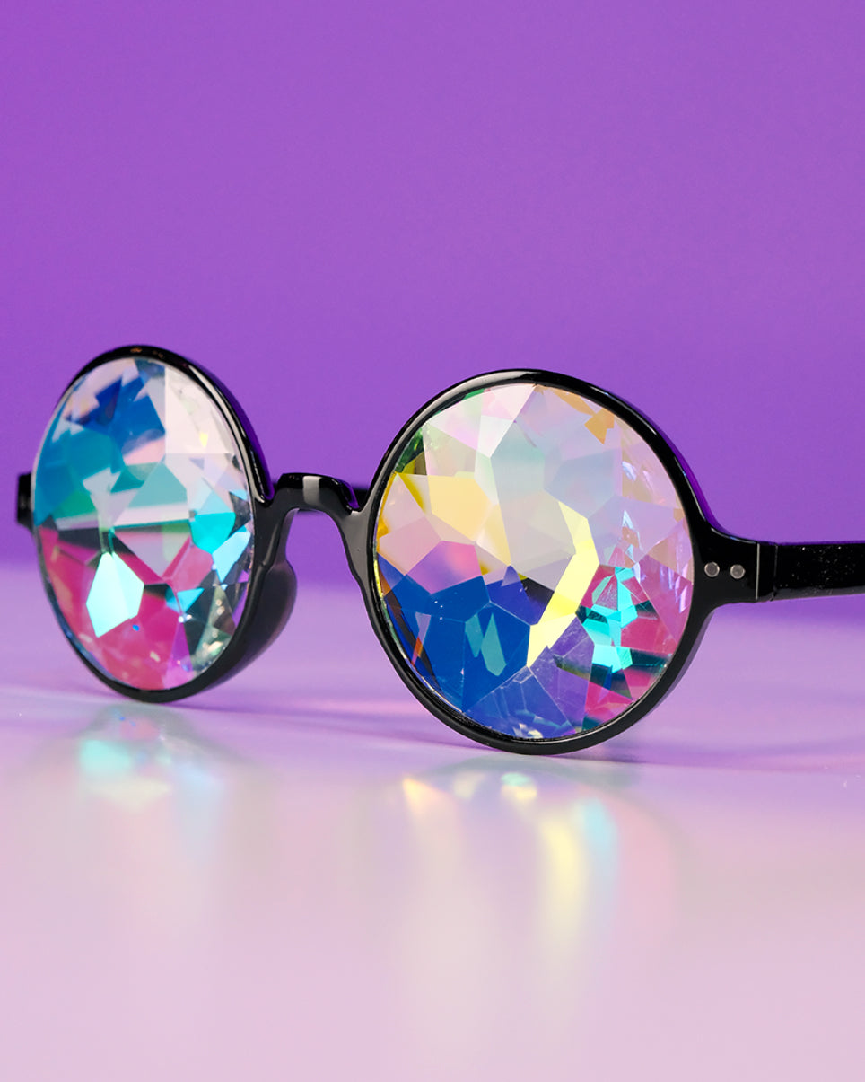 Round kaleidoscope glasses with black frame and iridescent rainbow lenses