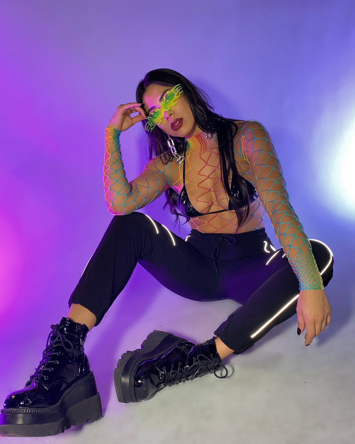 Black joggers with reflective trim on the legs and elastic cuffs, drawstring waist