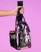 Small clear cross-body shoulder bag with black top flap and holographic print
