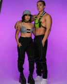 Unisex black joggers with reflective piping accents and ankle cuffs, drawstring waist