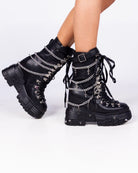 Black Holy Chains Edge mid-calf combat boots with silver chains and buckle strap, side view