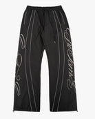 Black Monogram Men's Pants, black with drawstring waist and silver script monogram, flat lay