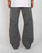 Charcoal Monogram Men's Pants, gray wide-leg with script monogram, back view on model
