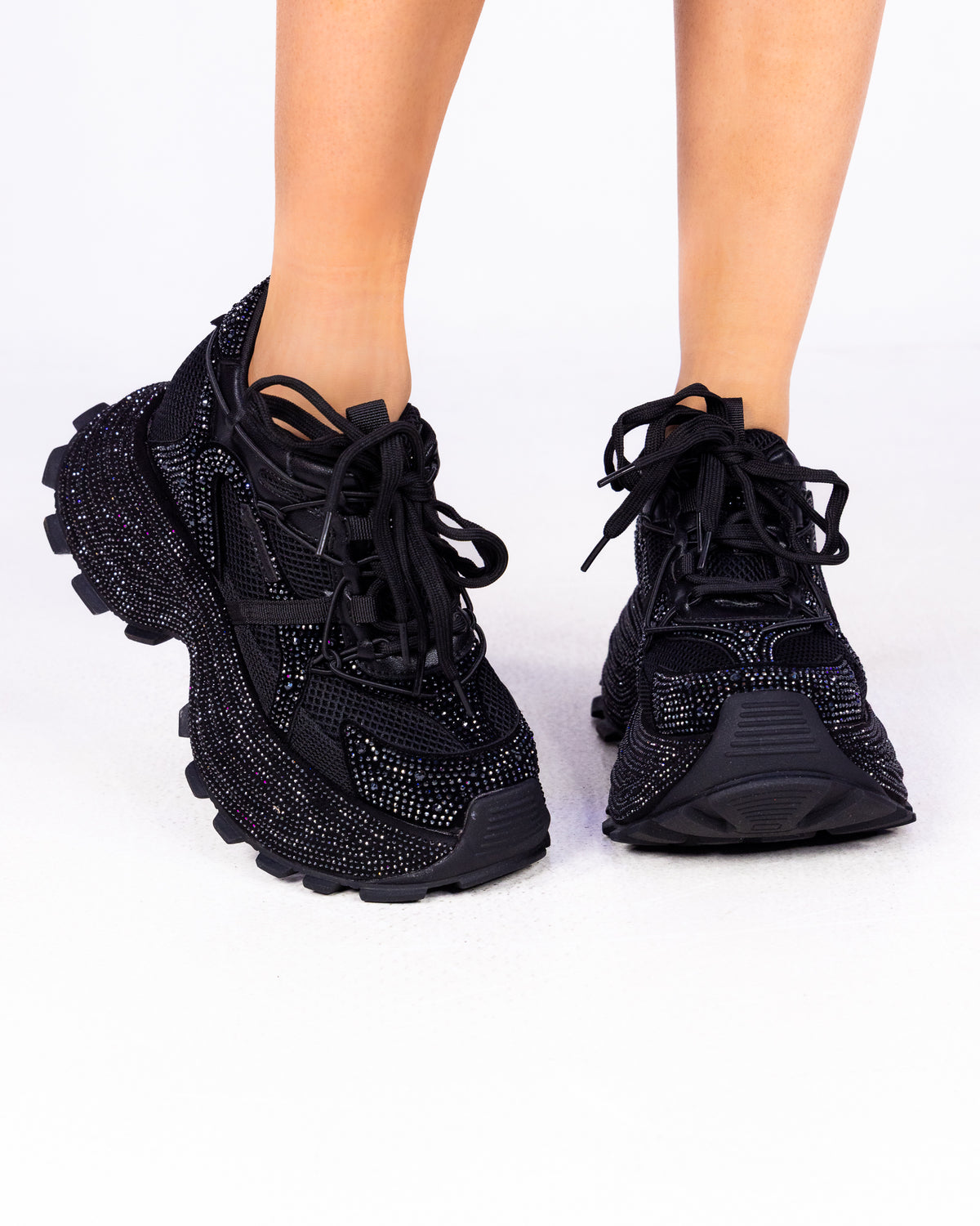 Midnight Sky black rhinestone wedge sneakers with chunky lug sole, front view on feet