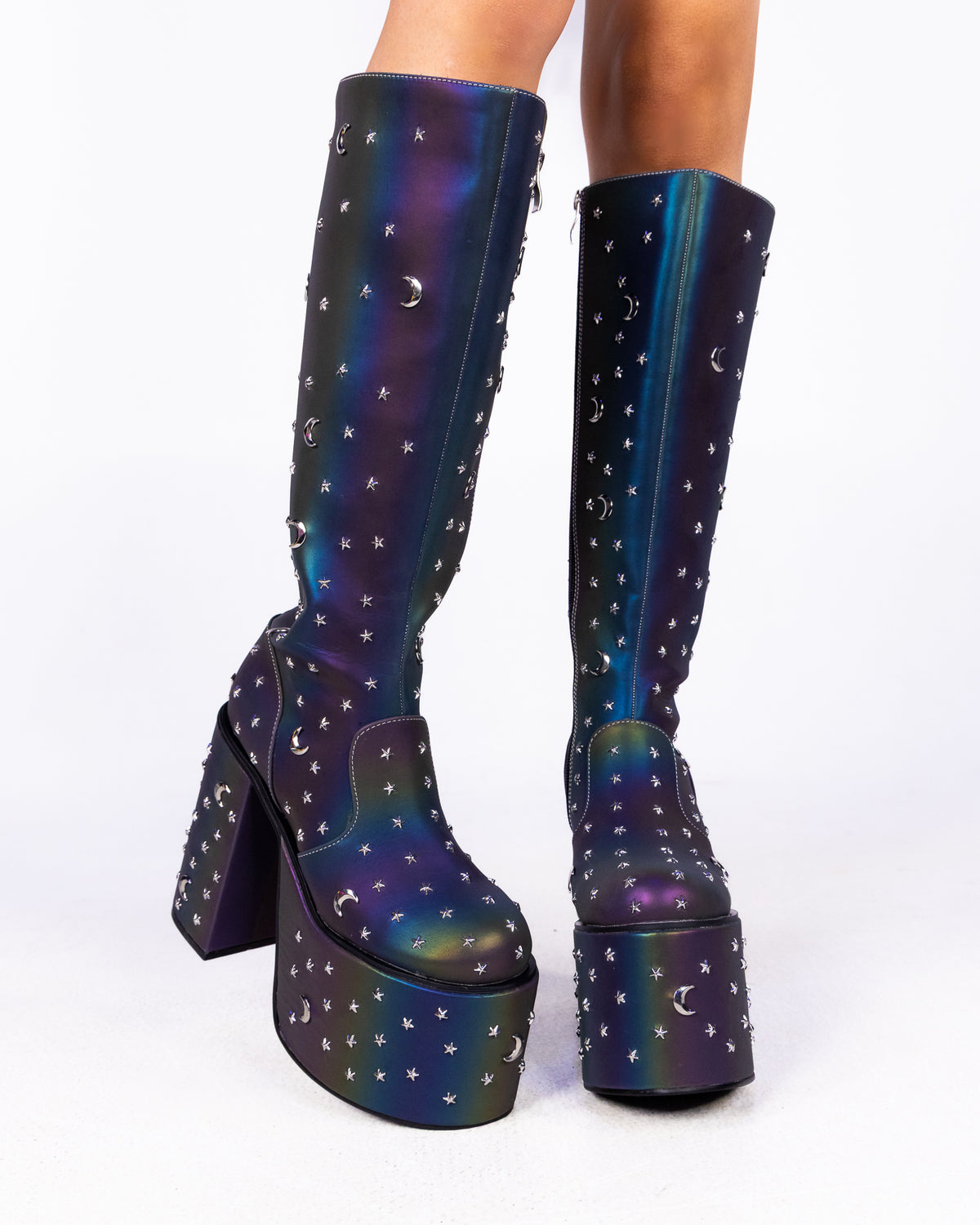 Milky Way reflective chunky platform knee-high boots, dark iridescent finish with star studs, front view