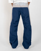 Navy Blue Blade Men's Reflective Pants, back view on model with gray EPITOME waistband panel