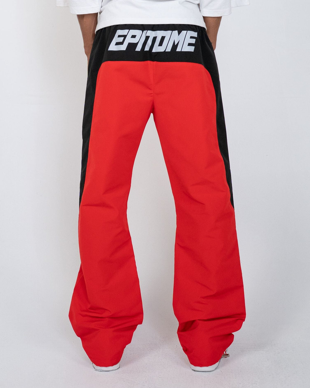Red Blade Men's Pants, back view on model with black EPITOME waistband panel